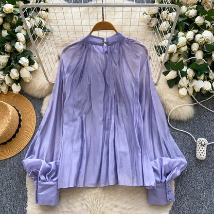 Elegant solid-color women’s blouse for everyday wear