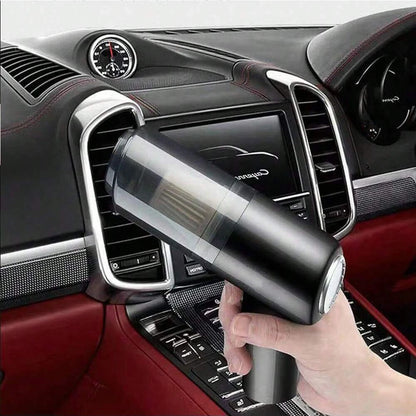 Compact handheld vacuum with suction, blow, and brush functions