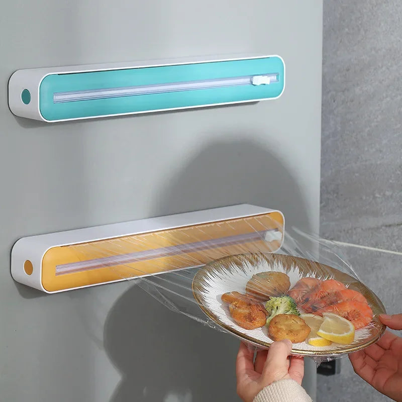 Foil and film storage box with built-in blade