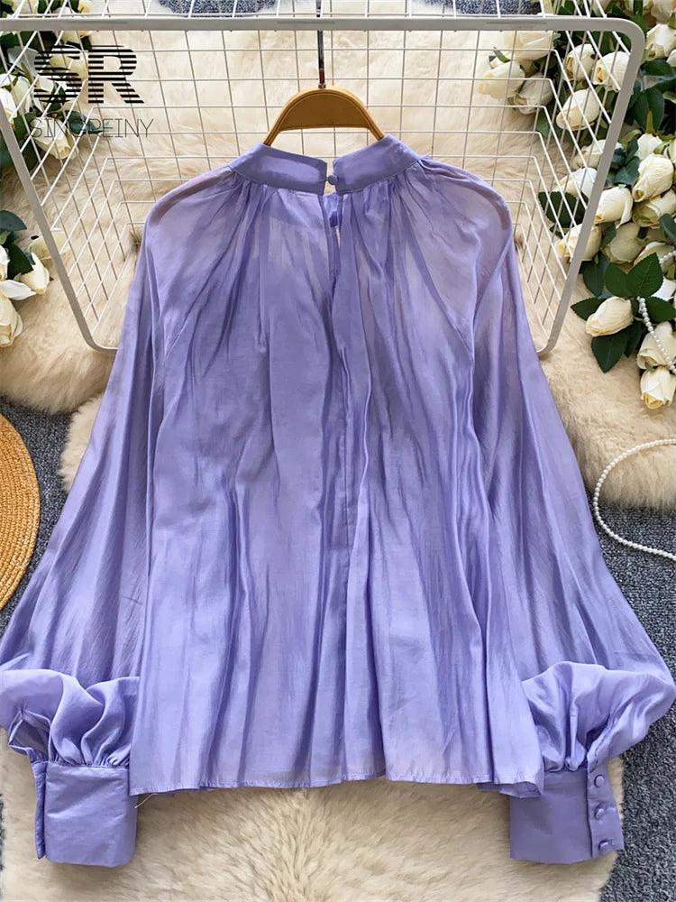 Elegant solid-color women’s blouse for everyday wear