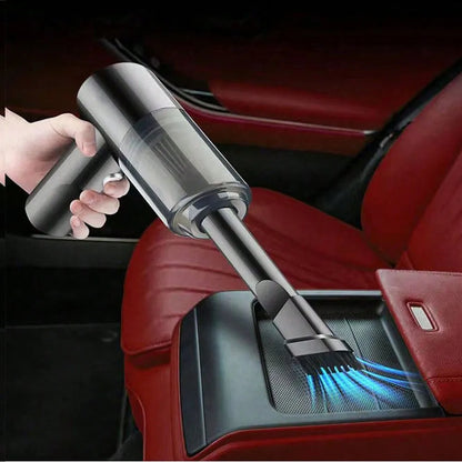 Compact handheld vacuum with suction, blow, and brush functions