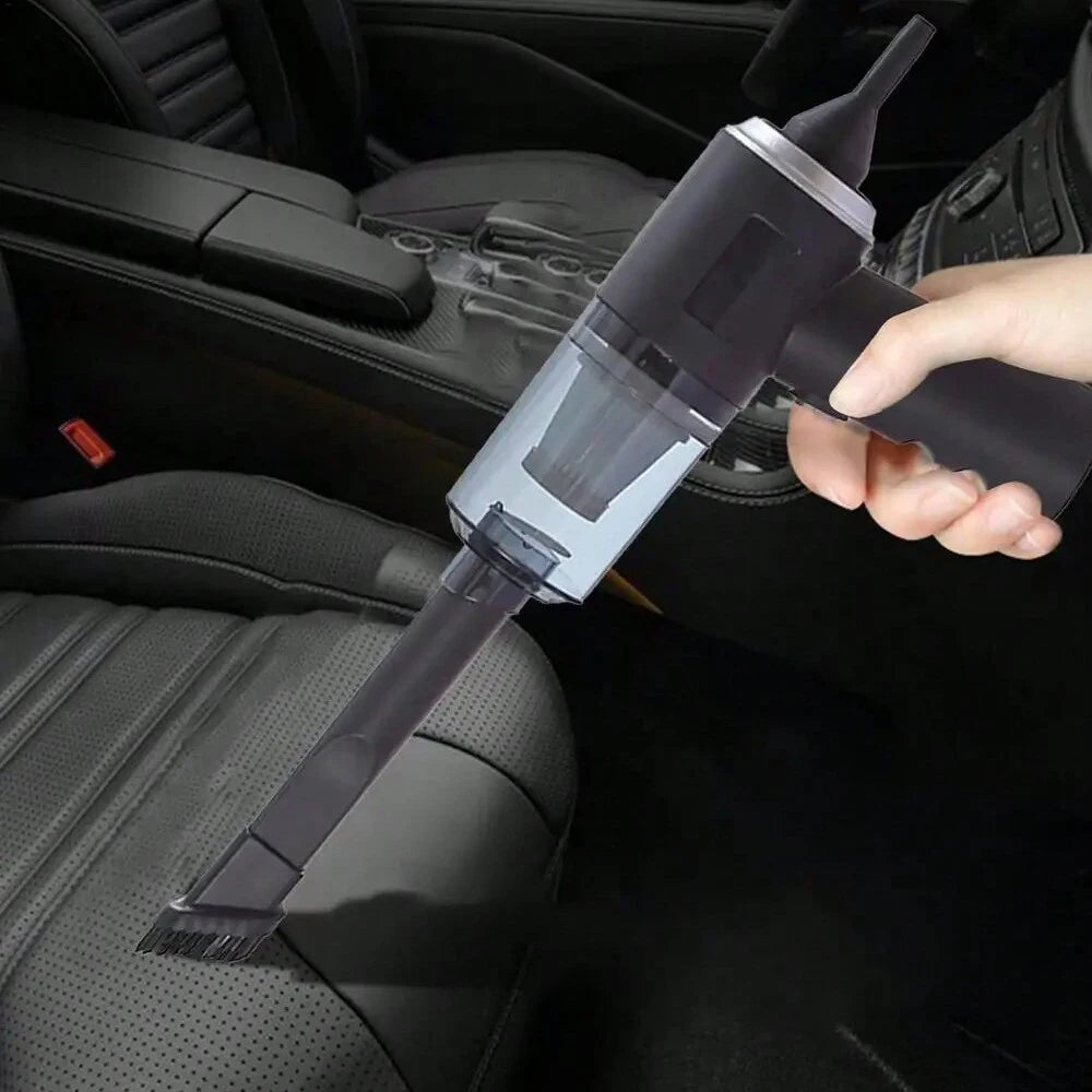 Compact handheld vacuum with suction, blow, and brush functions