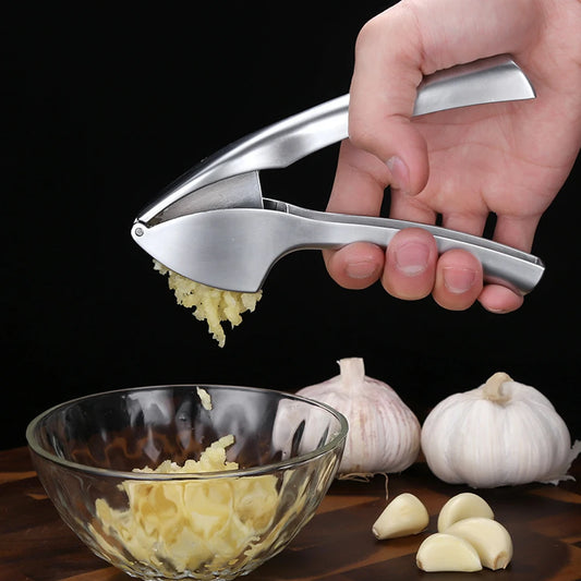 Kitchen garlic press with comfortable handle