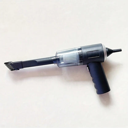 Compact handheld vacuum with suction, blow, and brush functions